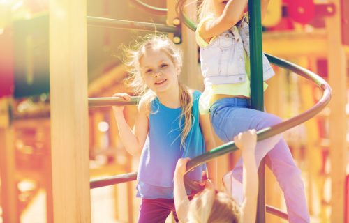 group-of-happy-kids-on-children-playground-P57YL4N.jpg